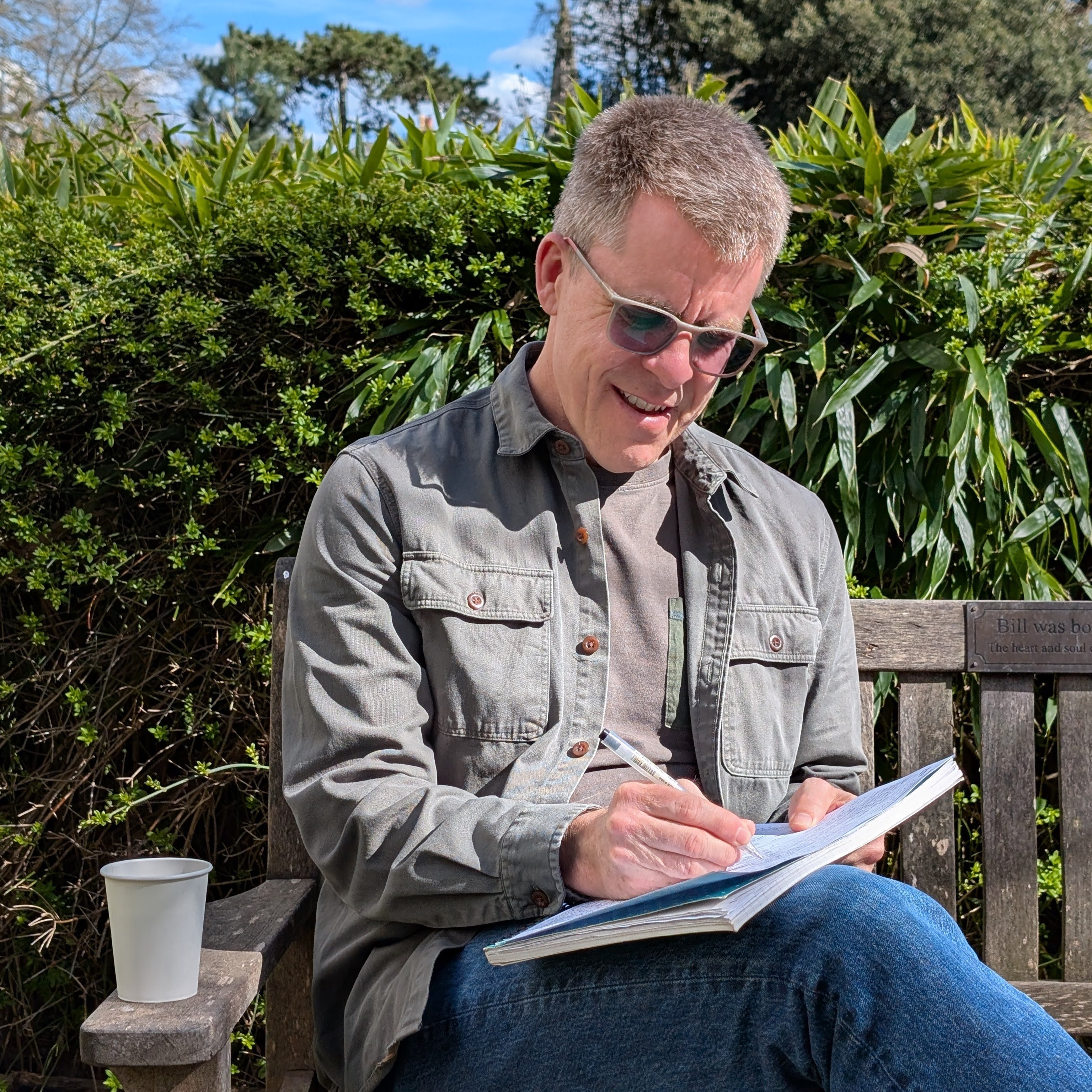 Benjamin writing in a physical notebook, representing the power of writing over thinking through emotional challenges